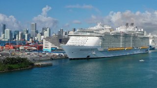 An aerial view from a drone shows the Royal Caribbean Symphony of the Seas Cruise ship which is the world's largest passenger liner docked at PortMiami after returning to port from a Eastern Caribbean cruise as the world deals with the coronavirus outbreak on March 14, 2020 in Miami, Florida.