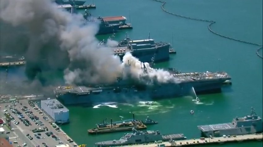 Firefighters respond to a fire on USS Bonhomme Richard in San Diego on Sunday, July 12, 2020.