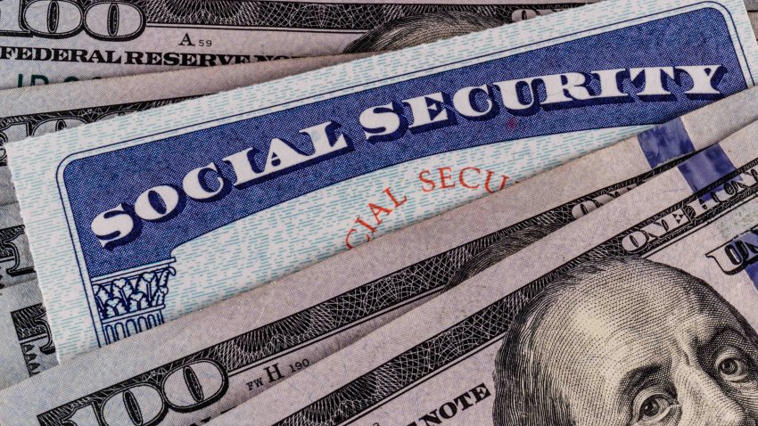 Social Security card and a bed of money representing the high cost of living on a fixed income II