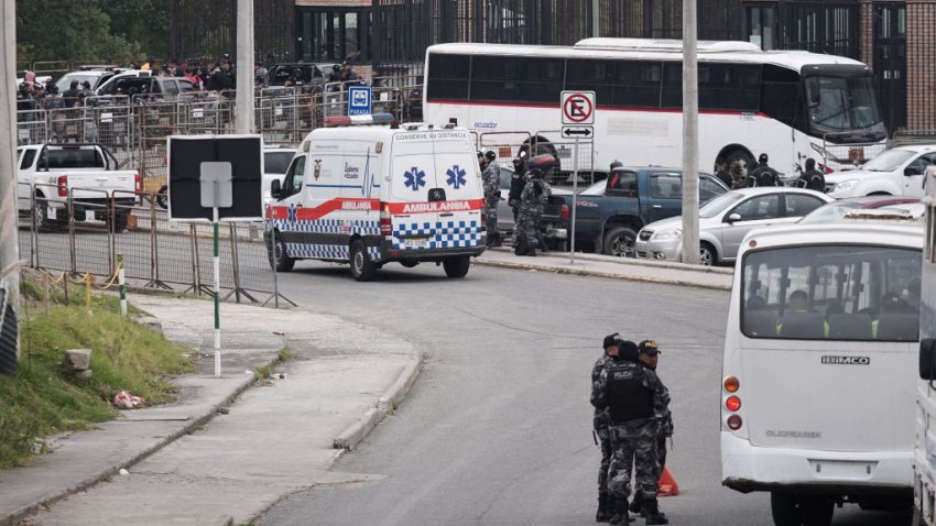 Police officers and an ambulance are seen outside the Turi prison in Cuenca, Ecuador on September 1, 2023. Almost 60 prison guards and police officers were being held hostage Friday by inmates across Ecuador. Ecuador’s SNAI prisons authority announced Thursday night that 50 prison guards and seven police officers were being held in six different prisons, without giving further details. The news came after two car bombs were detonated near buildings belonging to the prisons authority in Quito the previous evening, with no-one injured. Three grenade explosions also shook the capital. (Photo by Fernando MACHADO / AFP) (Photo by FERNANDO MACHADO/AFP via Getty Images)