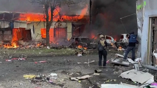Buildings burn after Russian missile hit a Ukrainian market