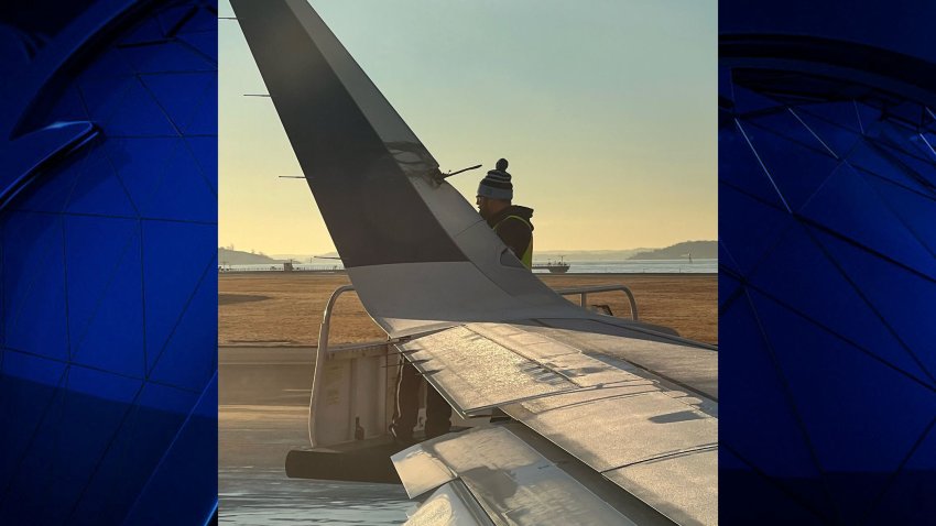 A JetBlue plane’s wing is seen damaged after it touched the tail of another JetBlue plane at Boston Logan International Airport on Thursday, Feb. 8, 2024.