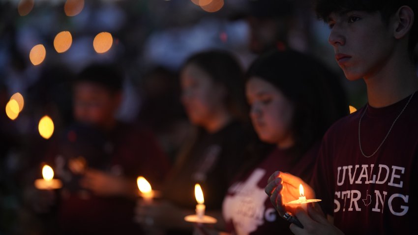 People attend a candlelight vigil for victims of a school mass shooting in Uvalde, Texas, the United States on May 24, 2023. The one-year anniversary of the school shooting killing 19 pupils and two teachers in Uvalde in the U.S. state of Texas arrives on Wednesday, marked by deep frustration as gun violence appears more rampant across the country. (Photo by Wu Xiaoling/Xinhua via Getty Images)