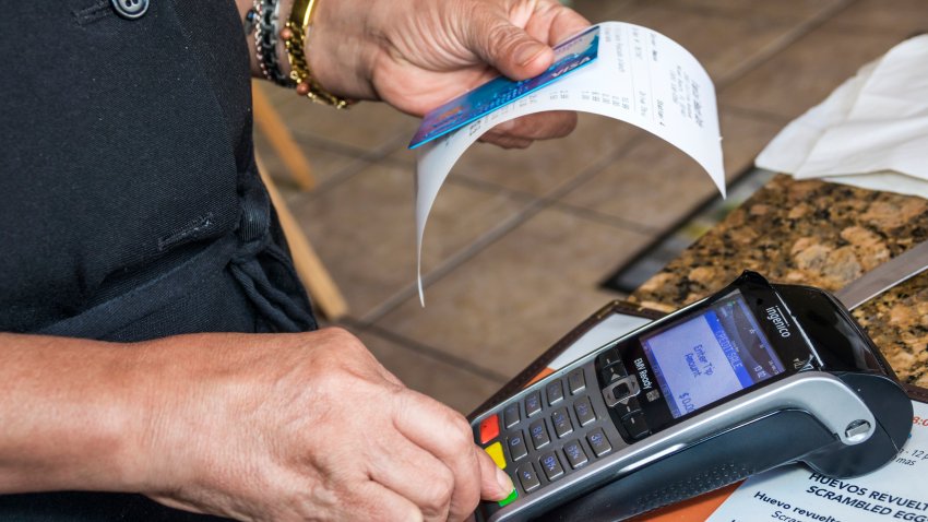 Miami Beach, Tropical Beach Cafe credit card scanner. (Photo by: Jeffrey Greenberg/Universal Images Group via Getty Images)