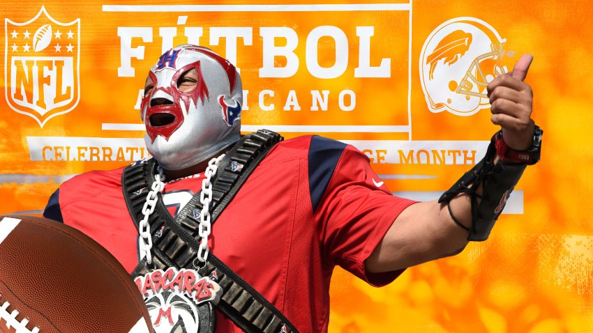 A fan with a Lucha Libre mask