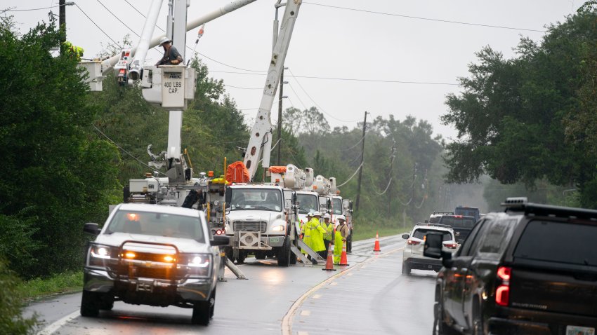 CRAWFORDVILLE, FLORIDA – SEPTEMBER 26: Utility crews repair a line damaged by an outer band of Hurricane Helene on the morning of September 26, 2024 near Crawfordville, Florida. Hurricane Helene is forecasted to make landfall nearby along the gulf coast this evening. (Photo by Sean Rayford/Getty Images)