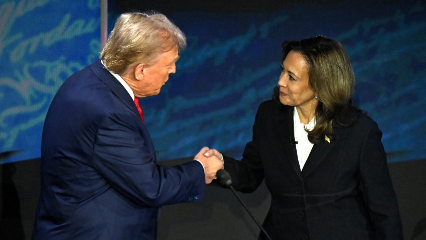 TOPSHOT – US Vice President and Democratic presidential candidate Kamala Harris (R) shakes hands with former US President and Republican presidential candidate Donald Trump during a presidential debate at the National Constitution Center in Philadelphia, Pennsylvania, on September 10, 2024. (Photo by SAUL LOEB / AFP) (Photo by SAUL LOEB/AFP via Getty Images)