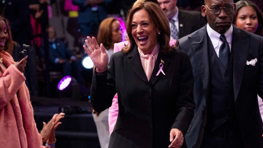 US Vice President and Democratic presidential candidate Kamala Harris walks next to Pastor Jamal Bryant (R) as she arrives during a church service at New Birth Missionary Baptist Church in Stonecrest, Georgia, October 20, 2024. (Photo by CHRISTIAN MONTERROSA / AFP) (Photo by CHRISTIAN MONTERROSA/AFP via Getty Images)