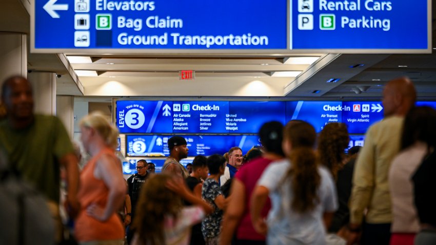 ORLANDO, FLORIDA – JULY 19: Passengers wait on long queues at check-in counters due to the global communications outage caused by CrowdStrike at Orlando International Airport on July 19, 2024, in Orlando, Florida. Businesses and airlines worldwide continue to be affected by a global technology outage attributed to a software update administered by CrowdStrike, a cybersecurity firm whose software is used by various industries around the world.  (Photo by Miguel J. Rodriguez Carrillo/Getty Images)