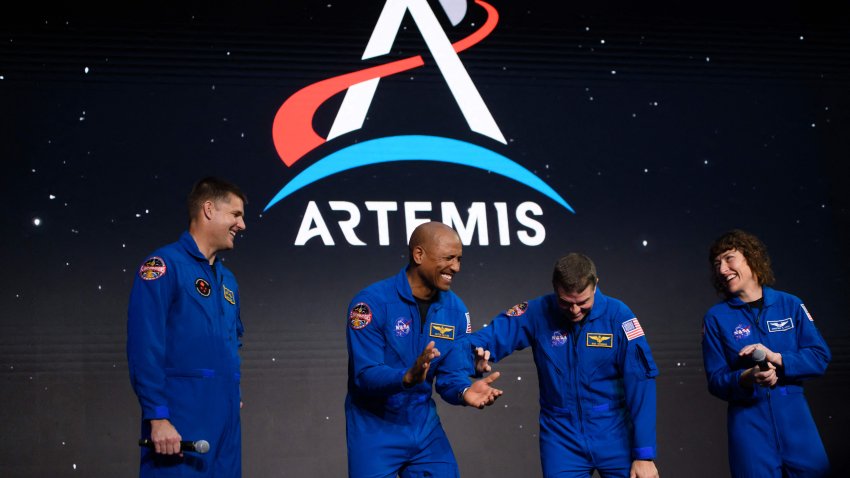 TOPSHOT – (L-R) Astronauts Jeremy Hansen, Victor Glover, Reid Wiseman and Christina Hammock Koch celebrate after being selected for the Artemis II mission who will venture around the Moon during a news conference held by NASA and CSA at Ellington airport in Houston, Texas, on April 3, 2023. – Traveling aboard NASAs Orion spacecraft during Artemis II, the mission is the first crewed flight test on the agencys path to establishing a long-term scientific and human presence on the lunar surface. (Photo by Mark Felix / AFP) (Photo by MARK FELIX/AFP via Getty Images)