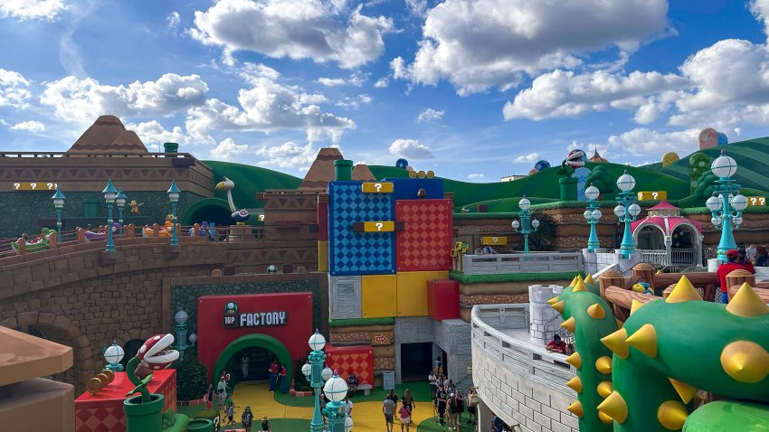In Super Nintendo World, guests with Power-Up Bands can hit the familiar question-mark boxes of the Mario universe, track their Mario Kart score and play drums like Donkey Kong to unveil hidden effects and Easter eggs. (Adrian Ruhi/Miami Herald/Tribune News Service via Getty Images)