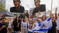 Israelis celebrate the release of Edan Alexander, an Israeli-US captive in the Gaza Strip since October 2023, at Hostages Square in Tel Aviv on May 12, 2025. Palestinian militant group Hamas announced on May 11, 2025 it would release Alexander as part of talks with the United States towards a ceasefire. (Photo by Menahem KAHANA / AFP) (Photo by MENAHEM KAHANA/AFP via Getty Images)