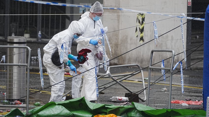 Forensic officers at the scene in Water Street near the Liver Building in Liverpool after a 53-year-old white British man was arrested when a car ploughed into a crowd of people during Liverpool FC’s Premier League victory parade. Picture date: Tuesday May 27, 2025. (Photo by Peter Byrne/PA Images via Getty Images)