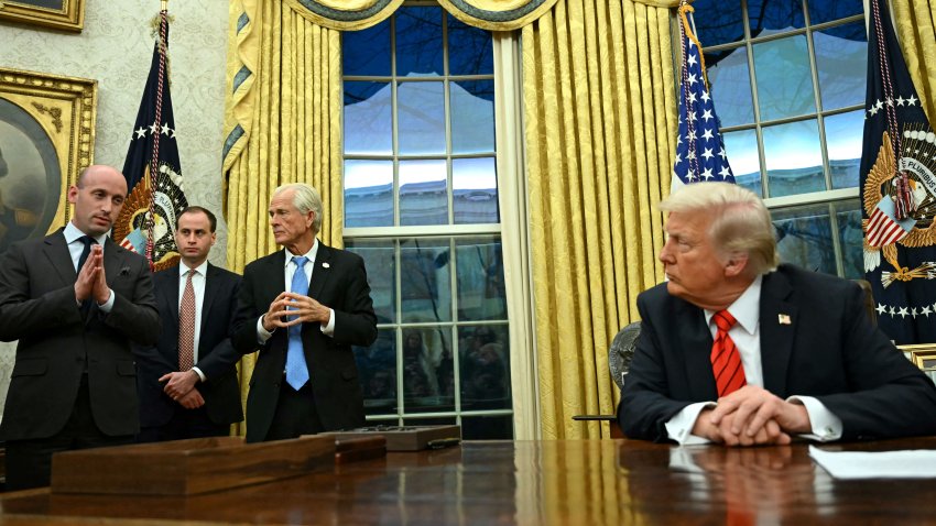 White House deputy chief of staff for policy and US homeland security advisor Stephen Miller (L), alongside counselor to US President Donald Trump, Peter Navarro (3rd L), speak after US President Donald Trump signed an executive order in the Oval Office of the White House in Washington, DC, on February 10, 2025. (Photo by ANDREW CABALLERO-REYNOLDS / AFP) (Photo by ANDREW CABALLERO-REYNOLDS/AFP via Getty Images)