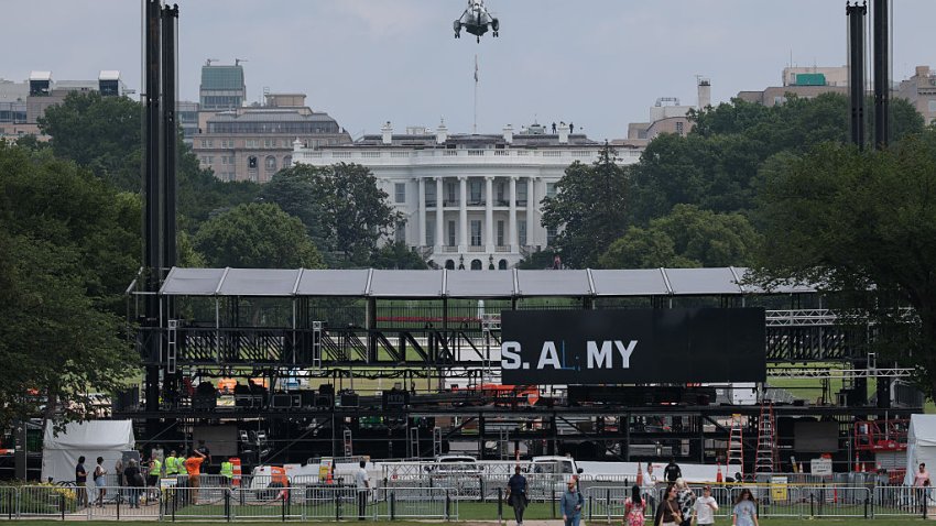 WASHINGTON, DC – JUNE 09: Marine One lands at the White House with U.S. President Donald Trump behind workers putting up a riser in front of the White House ahead of the Army’s 250th birthday parade and celebration on June 09, 2025 in Washington, DC. The U.S. Army will mark its 250th anniversary with a parade along the National Mall that will include 6,500 troops, 150 vehicles and 50 aircraft.  (Photo by Kayla Bartkowski/Getty Images)