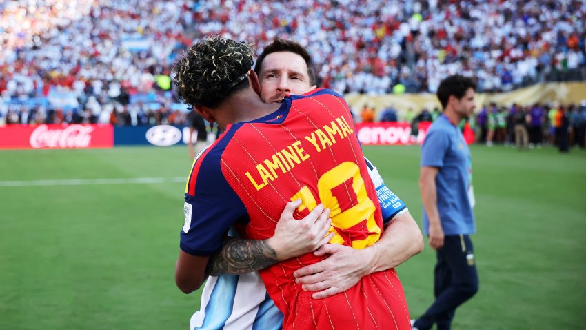 Lamine Yamal #19 of Spain is congratulated by Lionel Messi #10.