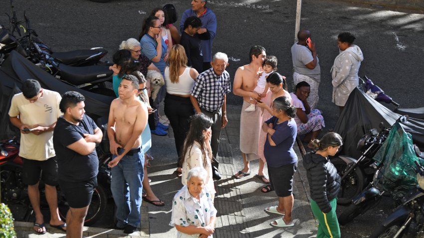 People evacuate after an earthquake in Medellin, Colombia on August 10, 2026. A strong earthquake struck Colombia on August 10 and was strongly felt in major cities such as Bogota and Cali, and even in Quito and Panama, according to the Colombian Geological Service and as confirmed by AFP reporters. (Photo by Jaime SALDARRIAGA / AFP via Getty Images)